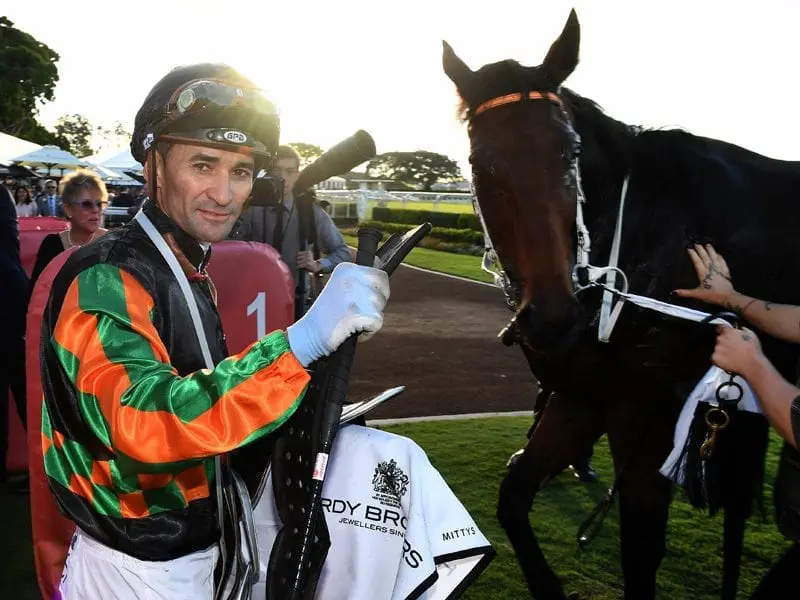 Everything went to plan for Sense of Occasion when he came from well back to win the Doomben Cup. Jockey Corey Brown gestures after riding Sense of Occasion to victory
