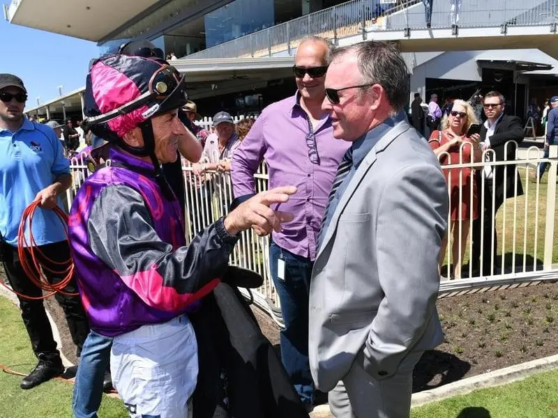 Jockey Robbie Fradd (left) and trainer Darryl Ward (right) after Another Whiskey's win at Doomben. Robbie Fradd