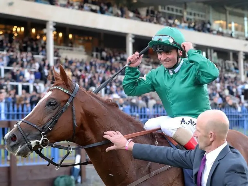 The Roger Charlton-trained Decorated Knight ridden by Andrea Atzeni wins the Irish Champion Stakes. Decorated Knight