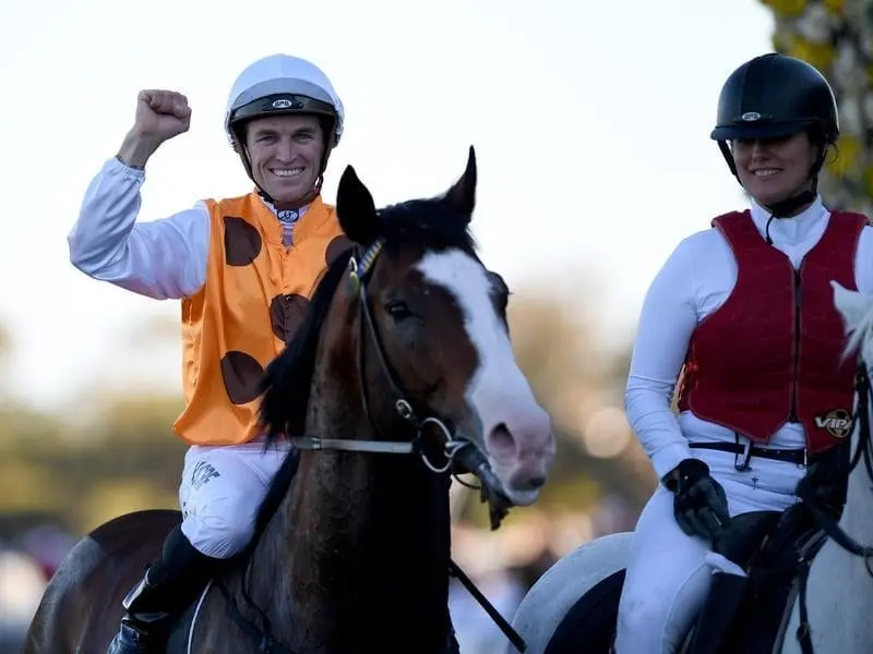 Jockey Josh Parr returns to scale on Menari after winning the Run To The Rose. Menari