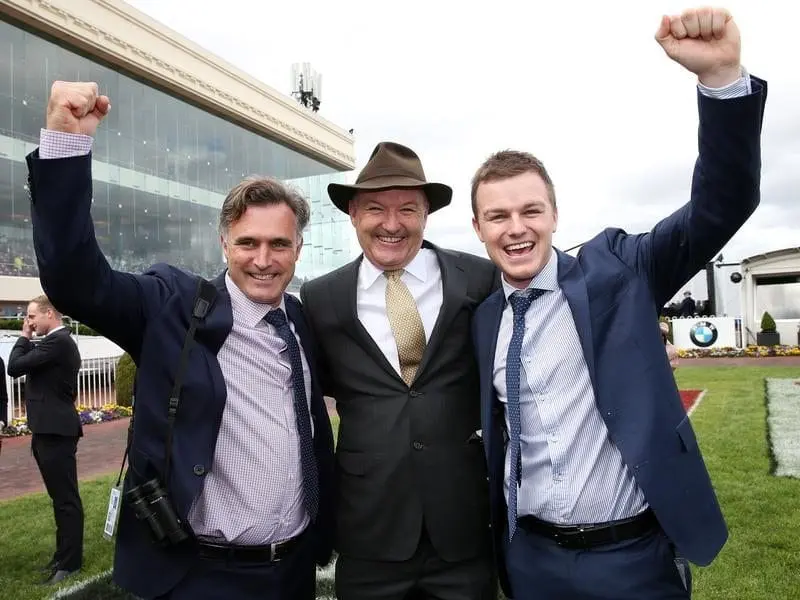 Boom Time causes upset at Caulfield, surprising even his owner and trainer David Hayes (c). Caulfield Cup winner Boom Time's trainers celebrate