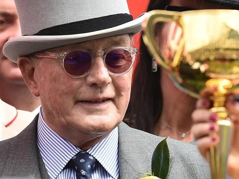 Retired businessman Lloyd Williams has six horses running in Tuesday's $6 million Melbourne Cup. Lloyd Williams is seen alongside the Melbourne Cup