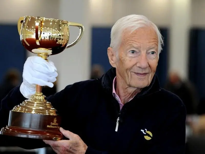 Legendary jockey Lester Piggott holds the Melbourne Cup, a race he never had the chance to ride in. piggott