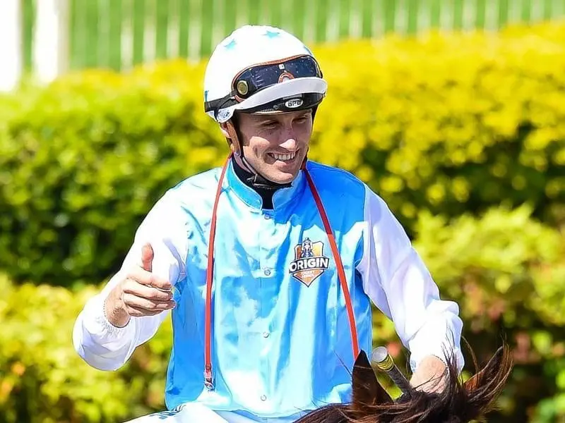 Jockey Tye Angland gestures after riding Realing to win race 4