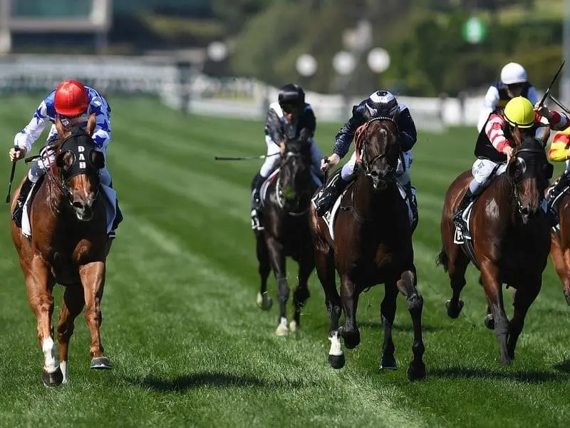 Regan Bayliss (L) rides Redkirk Warrior to win the Newmarket Handicap