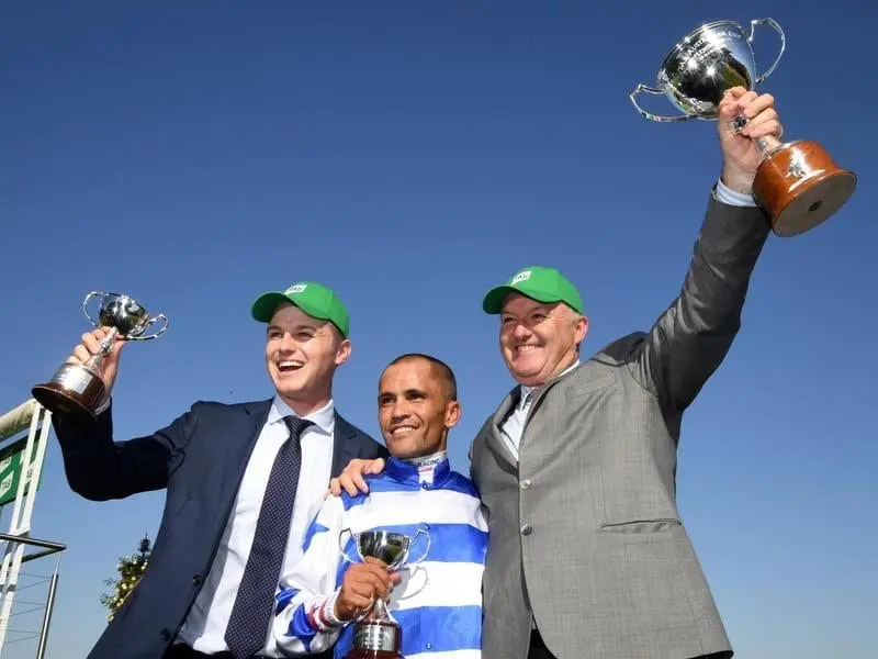 (L-R) Trainer Ben Hayes, jockey Michael Walker and trainer David Hayes