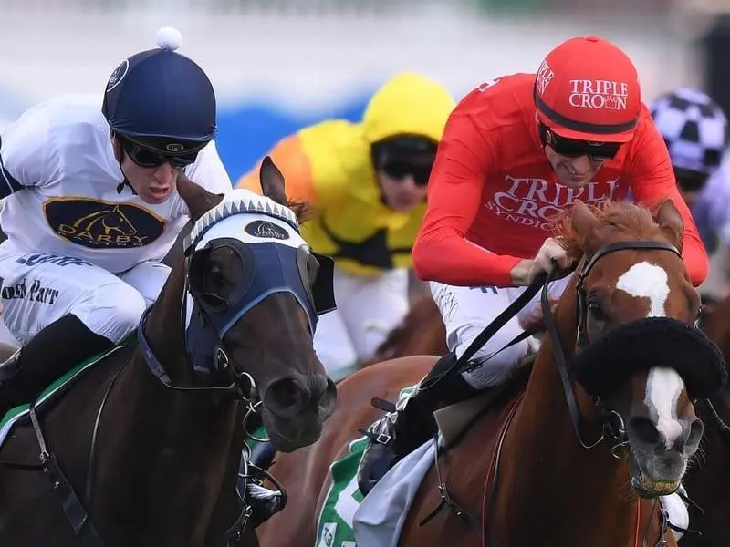 Burning Passion (left) prevailed in a three-way dogfight for the Hall Mark Stakes at Randwick. Burning Passion ridden by Joshua Parr (left)