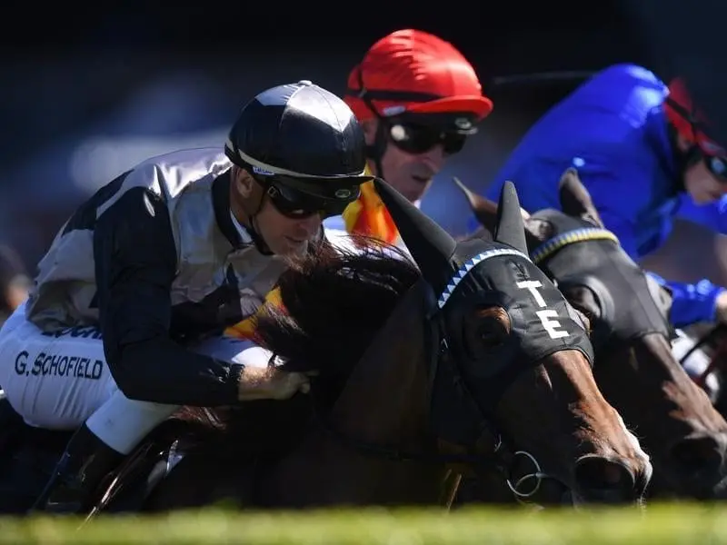 Houtzen ridden by Glyn Schofield (left) wins race three at Randwick