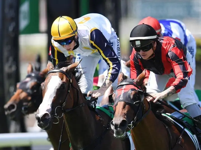 Jockey Boris Thornton (left) rides Hit Snooze to win