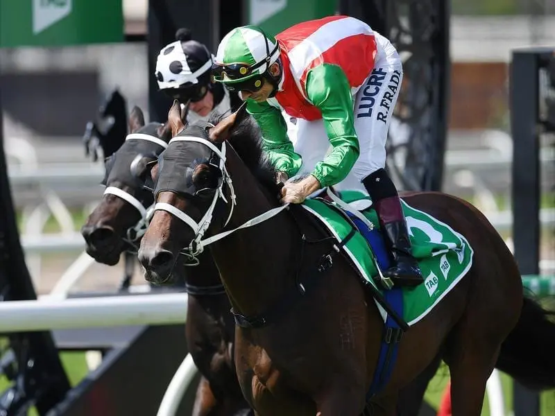 Jockey Robbie Fradd (right) rides Borazon to victory