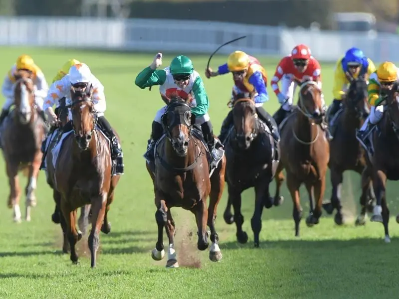 Trainer Richard Litt believes Castelvecchio (centre) will continue to improve in coming years. Jockey Joshua Parr rides Castelvecchio to victory