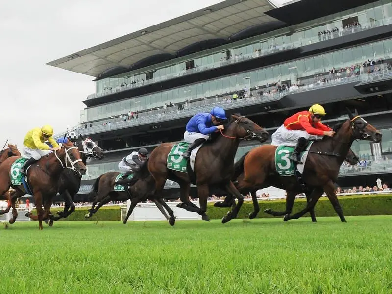 Winter Bride (right) runs in the Moreton Cup at Doomben ahead of a Group One assignment. winter bride