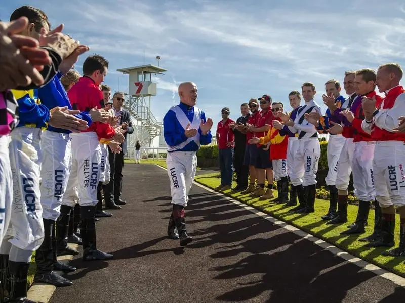 Doomben jockeys have formed a guard of honour for Jeff Lloyd who is retiring after a long career. Guard of honour for Jeff Lloyd.