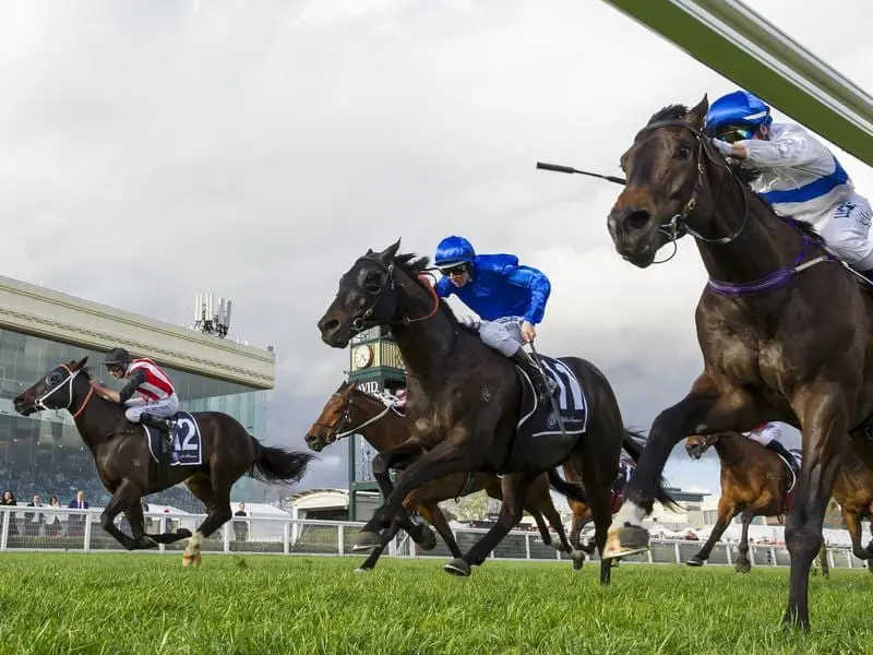 Renewal (L) has grabbed Zoustyle (fence) on the line to win the Testa Rossa Stakes at Caulfield. renewal