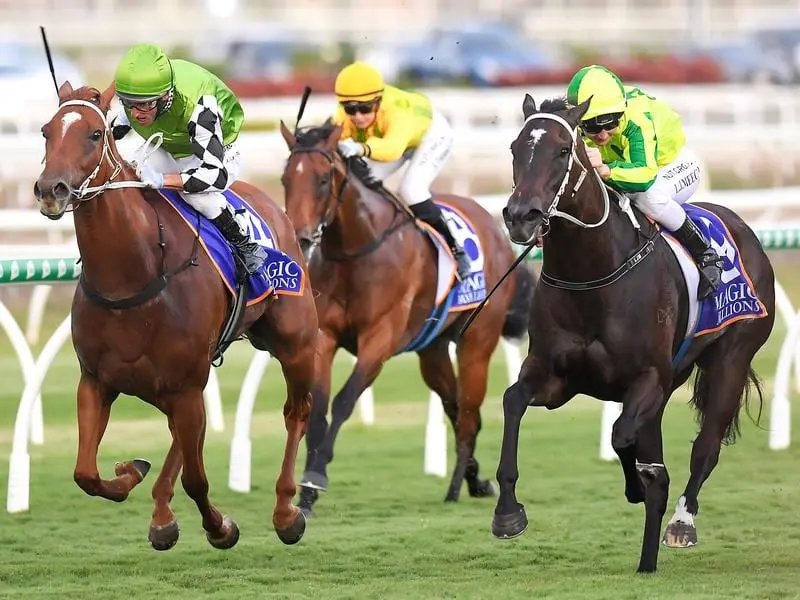 Jockey Damien Oliver rides Tahitian Dancer (left) to victory