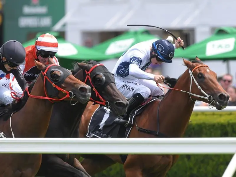 God Of Thunder (right) wins at Randwick.