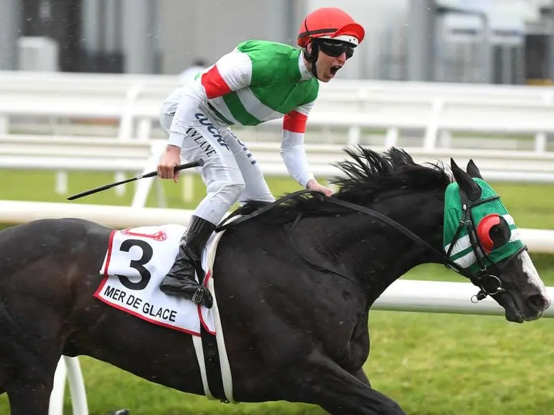 Damian Lane rides Mer De Glace to victory in the 2019 Caulfield Cup.