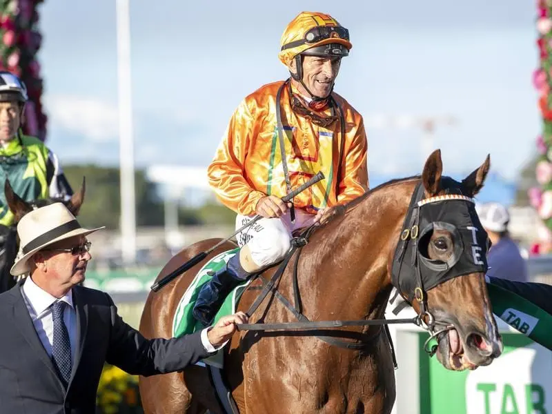 Jockey Robbie Fradd returns to scale after riding Tyzone to victory