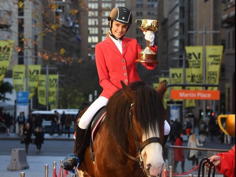 Model Rachael Finch on Melbourne Cup Clydesdale Lofty in Martin Place