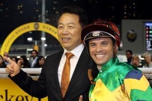 Trainer Ricky Yiu celebrates his 700th career win